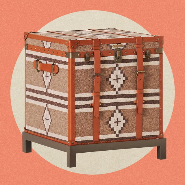 Storage trunk with patterned fabric and metal accents.