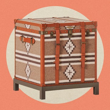 Storage trunk with patterned fabric and metal accents.