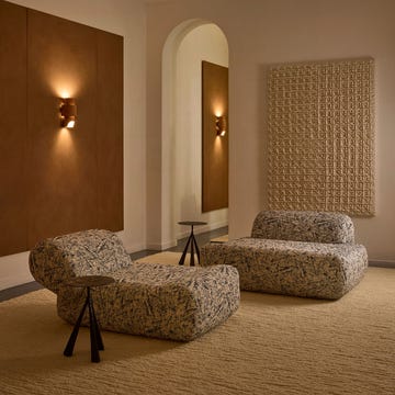 Modern interior with contemporary furniture and textured wall elements.