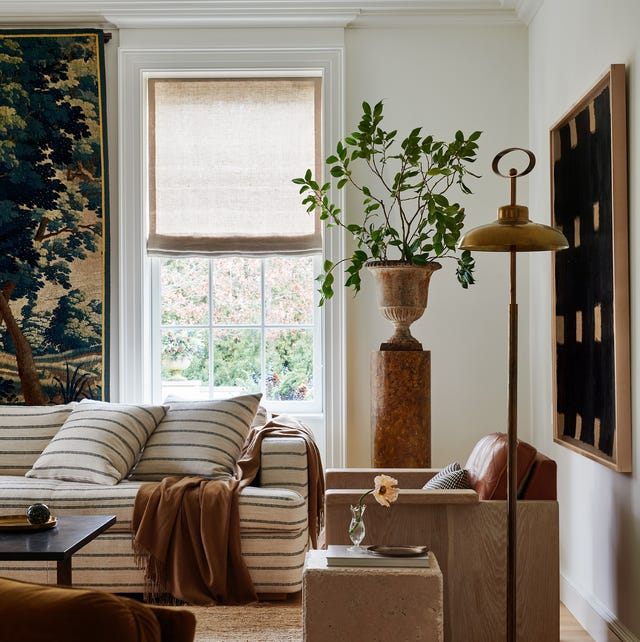 A cozy living room featuring a contemporary design with a mix of textures and natural elements