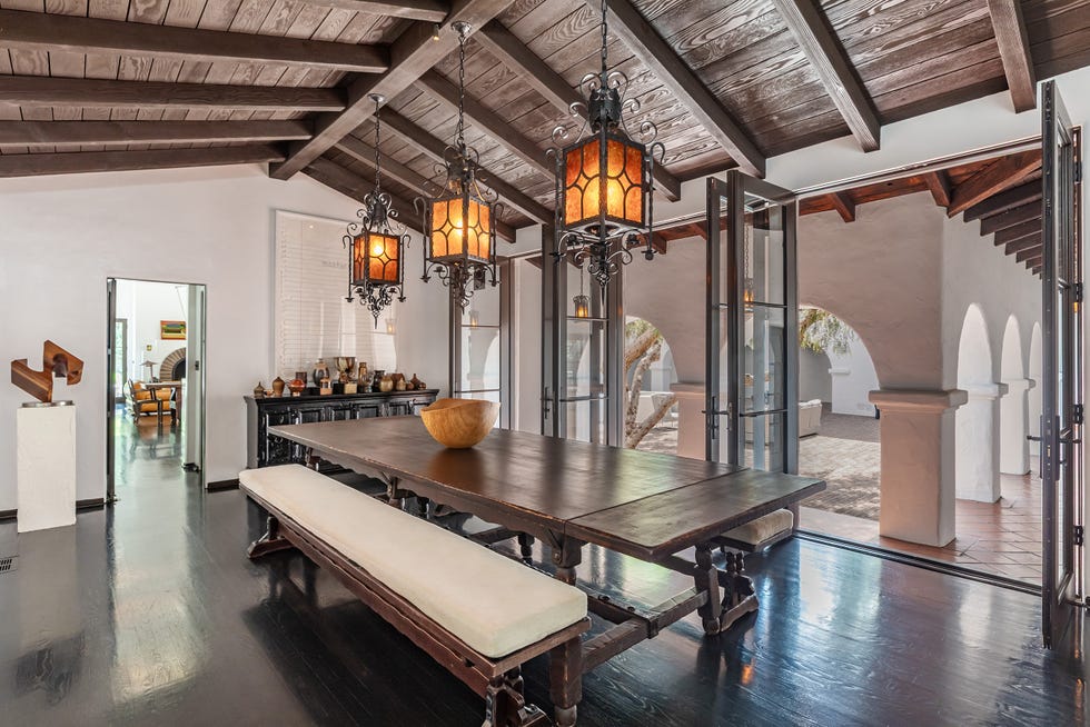 Dining area with rustic decor and open access to outdoor space