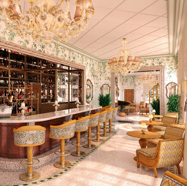 elegant bar interior with ornate decor and seating.