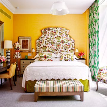Decorative bedroom with vibrant colors and floral patterns. Decorative bedroom with vibrant colors and floral patterns.