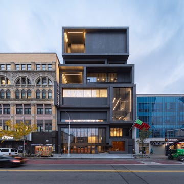 Contemporary building adjacent to historical architecture in urban setting Contemporary building adjacent to historical architecture in urban setting