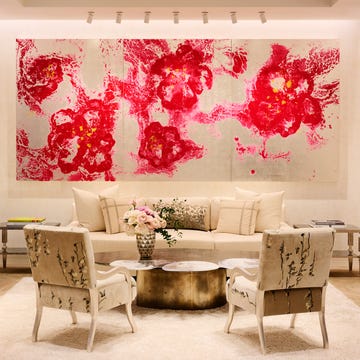 Lounge area featuring modern decor with floral artwork. Lounge area featuring modern decor with floral artwork.