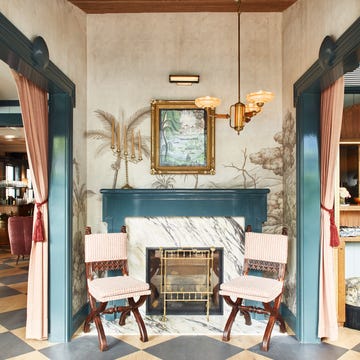 Cozy entryway featuring a fireplace and decorative elements. Cozy entryway featuring a fireplace and decorative elements.