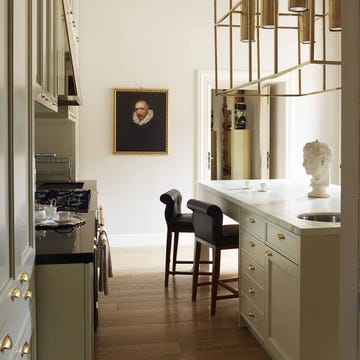 a room with a desk and chairs