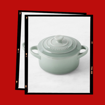 Ceramic cooking pot designed for stovetop or oven use.