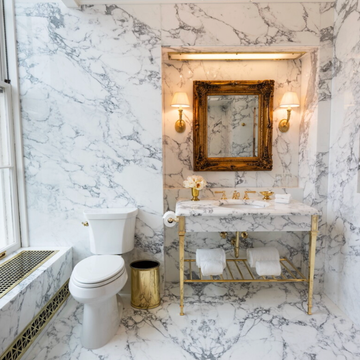 Elegant marble bathroom with classic fixtures. Elegant marble bathroom with classic fixtures.