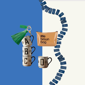 a collection of decorative items including mugs a keychain a pouch and dominoes arranged creatively